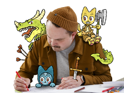 Illustrator Thomas Knappe tegner omgivet af fantasivæsner